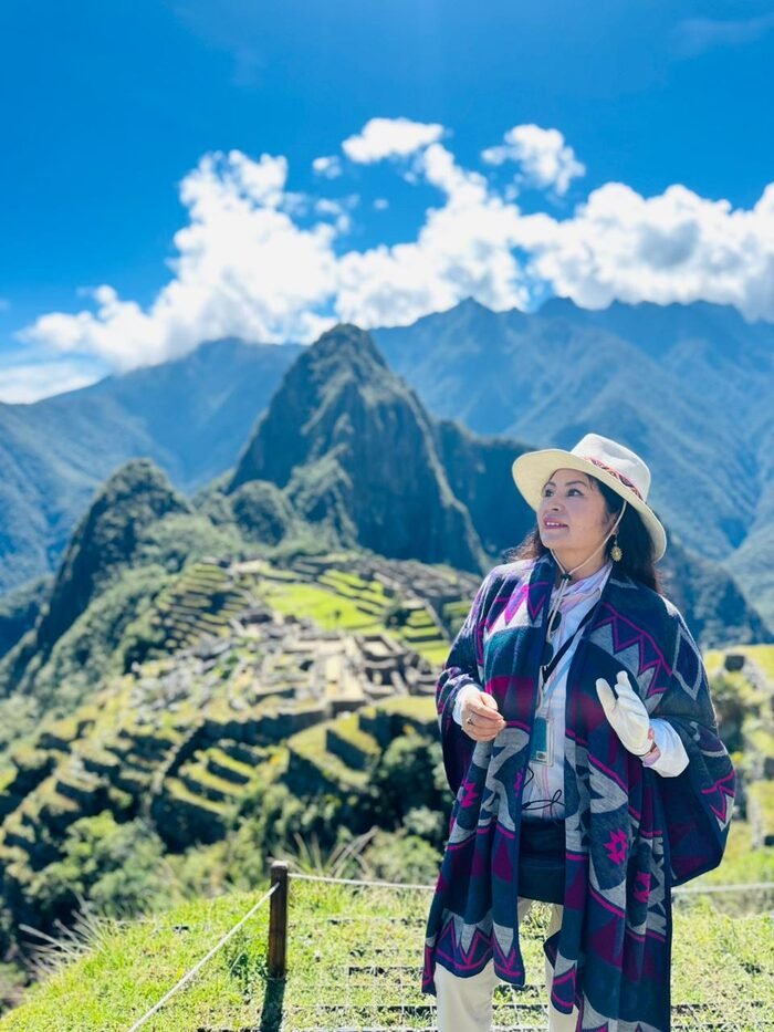 Woman wearing an alpaca ruana at Machu Picchu, Peru